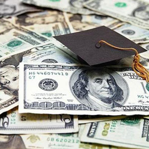 A graduation cap on a pile of US dollars- Moss Bollinger LLP