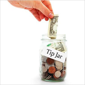 A jar labeled "Tips" with coins and bills inside- Moss Bollinger LLP