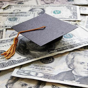 A graduation cap on a pile of US dollars- Moss Bollinger LLP