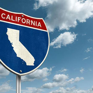 Road sign indicating the California state- Moss Bollinger LLP