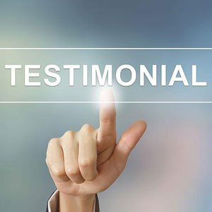 Hand pressing testimonial button- Moss Bollinger LLP