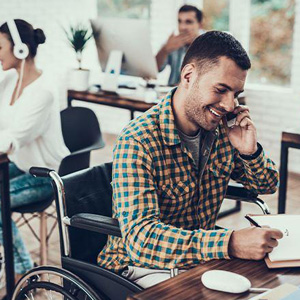 A man in a wheelchair having a phone conversation- Moss Bollinger LLP