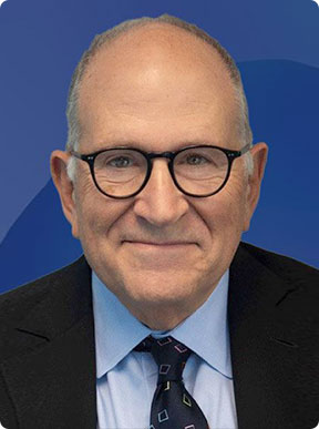A man in glasses and a suit with a pleasant smile - Moss Bollinger LLP