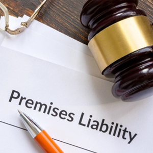 A gavel and pen on paper with the words Premises Liability - Moss Bollinger LLP