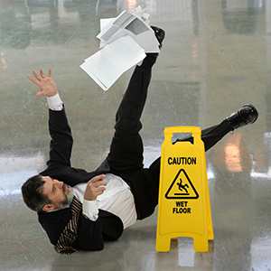 Man in suit slipped on wet floor - Moss Bollinger LLP